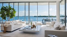 Boasts A Sleek Living Space That Offers Breathtaking Vistas Of The Bay And City Through Expansive Floor To Ceiling Windows. The Minimalist White Interior Is Adorned With Designer Sofas.