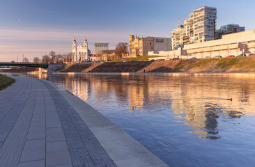 Wall Mural - Sunset over Neris river, church and skyscrapers of New Center of Vilnius, Lithuania, Baltic states.