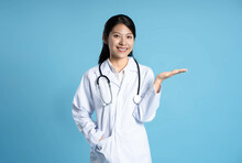 Image Of Asian Female Doctor Posing On Blue Background