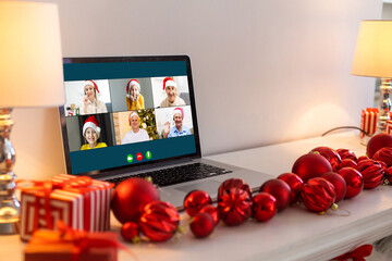 Wall Mural - Virtual meeting online. Video conference by laptop. Online business meeting. On the laptop screen, people who gathered in a video conference to work on-line