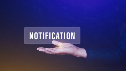 Businessman holding button notification on virtual screens, business, technology, internet and networking concept.