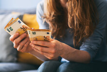Woman Counting Euro Cash At Home