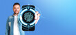 © ImageFlow - Man holding a phone with fingerprint hologram, verification and copy space