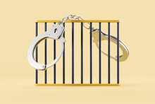 Closed Handcuffs Hanging On Jail Bars