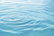 Serene blue water surface background featuring soft and calm circles, creating a tranquil and soothing scene.