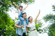© STOCK88PHOTOGRAPHER - image of asian family walking in the park