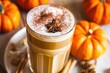 pumpkin spice latte on a decorated table