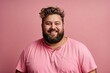 © Marpa - Happy young man with overweight and beard isolated on a pink background, looks into the camera and smiles. Fat guy in a pink shirt