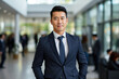 © Michael - Portrait of an Asian successful businessman leader in an expensive suit against the backdrop of the office