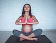 © georgerudy - Pregnant woman doing yoga