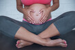 © georgerudy - Pregnant woman doing yoga