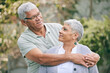 © Charlize Davids/peopleimages.com - Hug, love and senior couple in a garden with care, trust and support, conversation and bond outdoor. Happy, marriage and elderly man with old woman in backyard embracing retirement, relax and smile