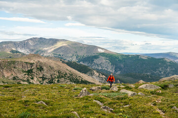 Canvas Print - Hiker Climbing Stormy Peaks Pass With Ramsey Peak In the Distance