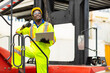 © Quality Stock Arts - African male dock worker control loading containers cargo at warehouse container shipyard. Marine and carrier staff employee. cargo loading operator shipping export logistics ship yard.