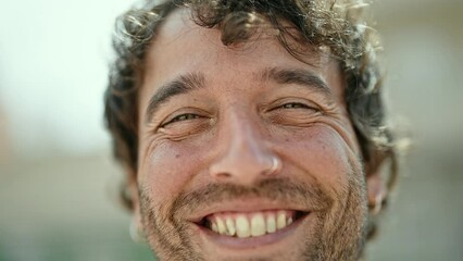 Poster - Young hispanic man smiling confident standing at street