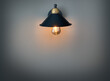 Retro sconce with a light bulb under the shade,