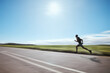© Azee Jacobs/peopleimages.com - Runner blur, fast and man on road outdoor, cardio or healthy body fitness. Athlete speed, sprint or exercise in competition, workout training or race on street in wellness at countryside mockup space