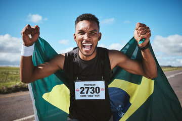 Portrait, sports and flag of Brazil with a man runner on a street in nature for motivation or success. Fitness, winner and celebration with an athlete cheering during a cardio or endurance workout