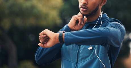 Sticker - Hand, fitness and watch for pulse with a man runner outdoor in nature for cardio or endurance training. Exercise, time and heart rate with a young athlete in the forest to workout for health closeup