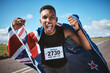© Azee Jacobs/peopleimages.com - Portrait, training and flag of New Zealand with a man runner on a street in nature for motivation or celebration. Sports, winner and success with an athlete cheering for cardio or endurance training