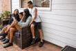 © Austockphoto - First nations family sitting together on couch outside