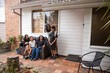© Austockphoto - First nations family sitting together on couch outside