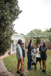 © Austockphoto - Aboriginal family playing with dog in backyard