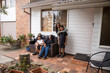 © Austockphoto - Aboriginal family sitting on outside chair