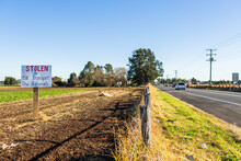 Sign Protesting Forced Land Acquisition For Singleton Bypass