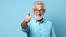 Senior Man Standing Over Isolated Blue Background Doing Happy Thumbs Up Gesture With Hand.