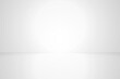 © fatima - Empty wall mockup, blank studio room with white wall with a spotlight on a flat floor for display product.