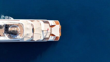 Wall Mural - Aerial drone top down photo of latest technology mega yacht luxurious wooden stern anchored in deep blue sea