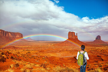 Wall Mural - Woman with a green backpack.