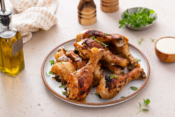 Wall Mural - Roasted chicken drumsticks with garlic and herbs