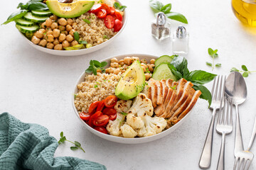 Healthy high protein lunch bowl with grilled chicken, roasted cauliflower, chickpeas and quinoa