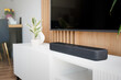 © Proxima Studio - Soundbar in a modern home. Listening to music