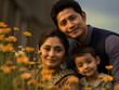 A Nepalese family pauses at the edge of a field of wildflowers. The late afternoon sun casts an orange glow across their eyes frozen in a moment of peacefulness as they take in the