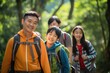 © Justlight - An active Thai family out on a hike. The children excitedly explore and investigate what lies ahead as the parents offer support and guidance.