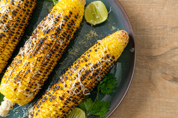 Wall Mural - barbecue and grilled corn with cheese and lime