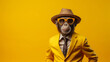 © amila - Monkey wearing a yellow colour business suit, sunglasses and bowler hat in yellow background