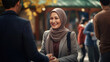 Businesswoman in a headscarf and in a suit smiles to business partners
