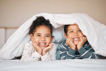 siblings, happy and portrait of children in bed in blanket for bonding, love and fun at home. family