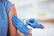 © Talia Mdlungu/peopleimages.com - Healthcare, vaccine and needle on arm of person in hospital for covid, flu or immunization closeup, Doctor, hands and zoom on patient at a clinic for medical, consultation and vaccination injection