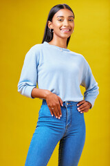 Wall Mural - Smile, fashion and student with portrait of woman in studio for future, pride and happy. Youth, confident and college with Indian person on yellow background for future, learning and trendy style