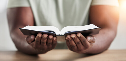 Wall Mural - Bible, book reading and hands with closeup of religion study at home for worship and spiritual support. Faith, christian knowledge and person with gratitude, scripture education and god guidance