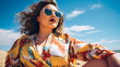 © Stock'd  - beautiful plus size woman at beach in sunshine wearing floral wrap dress, fashion editorial model sitting on sand