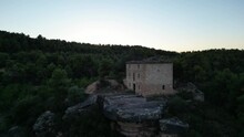 Aerial Shooting Of A Sunset In An Abandonned Farmhouse In The Middle Of An Almond Trees Field.