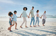 © Mumtaaz D/peopleimages.com - Walking, holding hands and family outdoor on a beach with love, care and happiness on travel vacation. Parents, grandparents or men and women with children at sea for holiday, journey or adventure