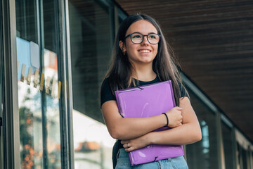 Wall Mural - teenager student in front of the door of the institute or college