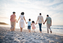 Walking, Holding Hands And Back Of Big Family At The Beach For Travel, Vacation And Adventure In Nature. Love, Freedom And Rear View Of Children With Parents And Grandparent At Sea For Ocean Journey